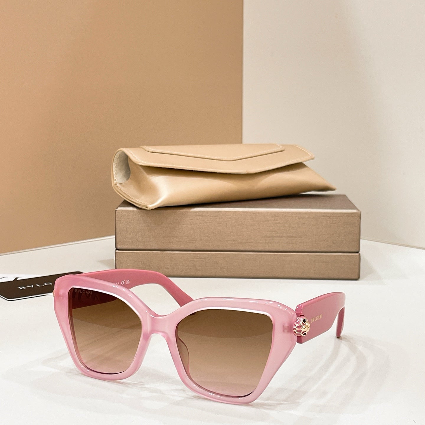 Bvlgari cat-eye sunglasses with pink frames and dark lenses