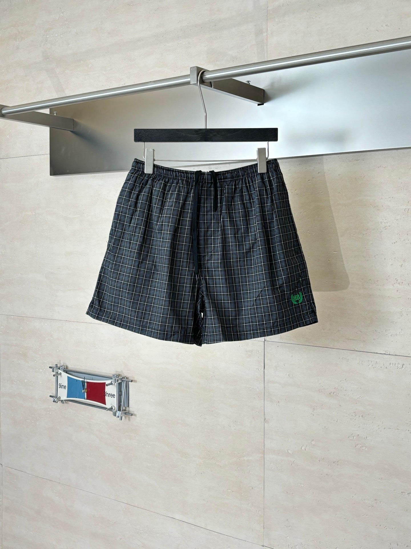 Balenciaga plaid shorts with elastic waistband and side pockets, dark check
