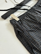 Balenciaga plaid shorts detail with elastic waist and drawstring, dark check fabric