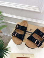 Monogram sandals with black adjustable straps and silver buckles, tan footbeds
