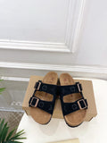 Monogram sandals with two black straps and silver buckles, tan footbed