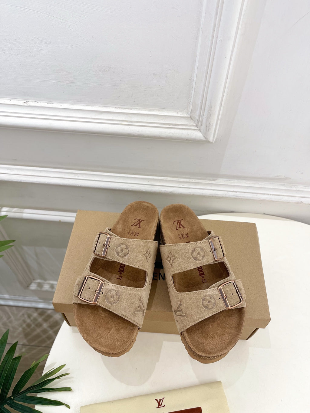 Louis Vuitton two-strap slide sandals, tan monogram canvas with buckled straps