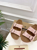 Louis Vuitton sandals with pale pink straps and monogram pattern, shown angled on box