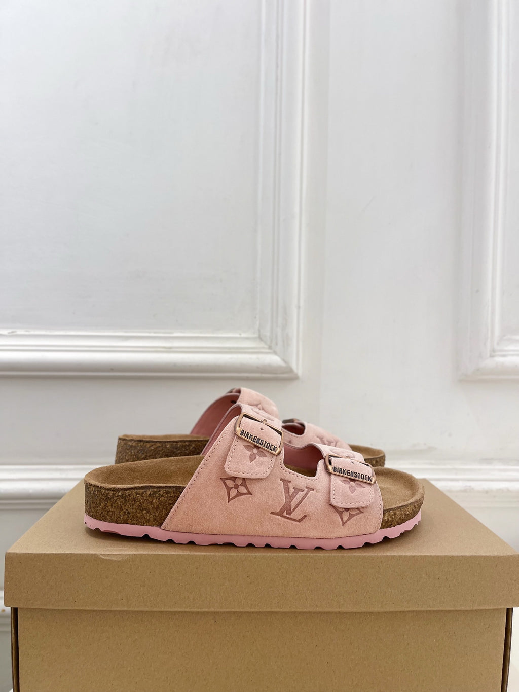 Louis Vuitton sandals in pale pink with monogram strap detail and adjustable buckle