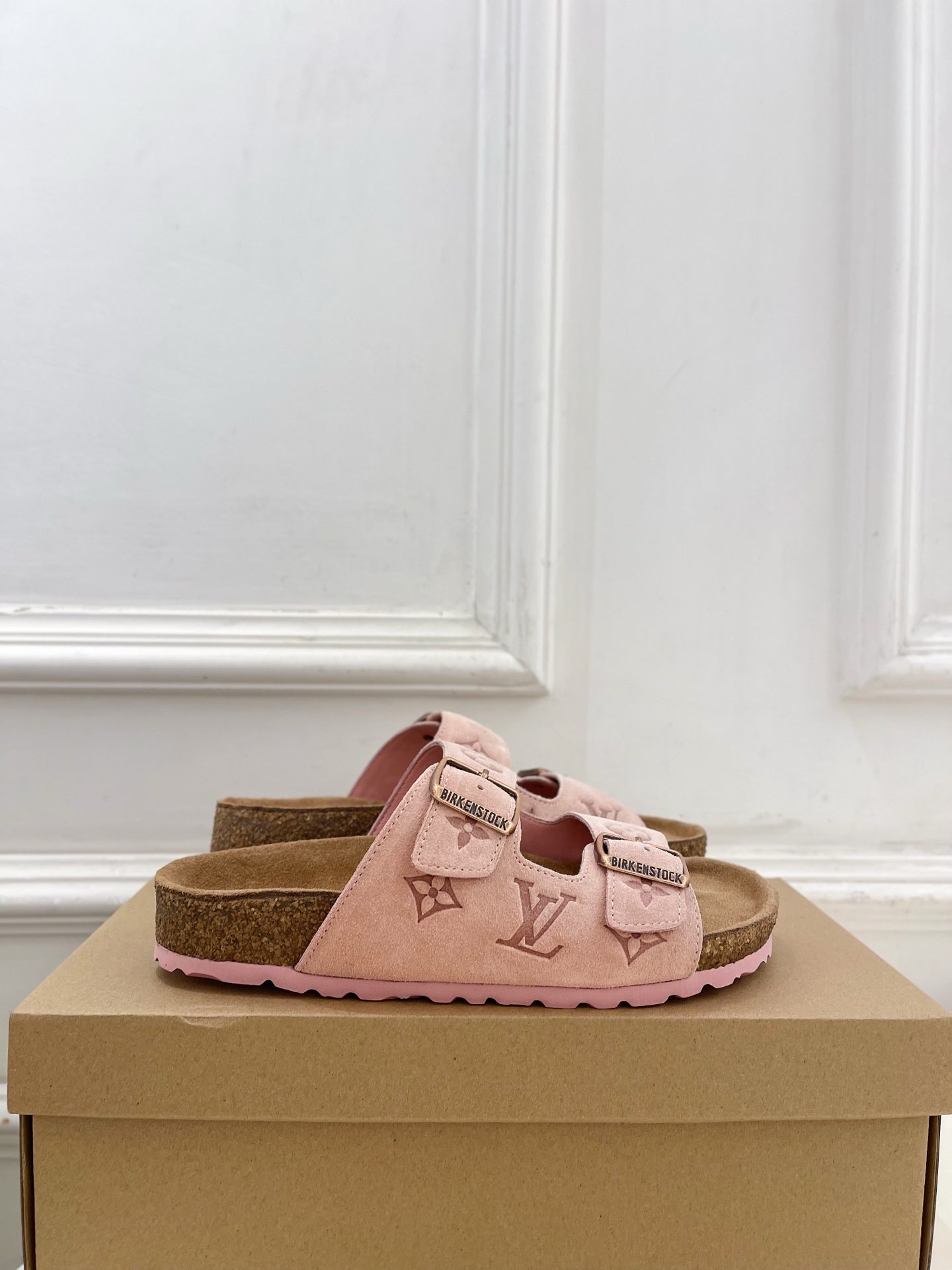 Louis Vuitton sandals in pale pink with monogram strap detail and adjustable buckle