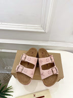 Louis Vuitton sandals with pale pink straps, monogram pattern, and metal buckle straps