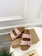 Louis Vuitton sandals pair with pale pink footbed straps, monogram motifs, and metal buckles