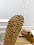 Birk-like rubber sandal sole with raised tread and tan strap sandal side view