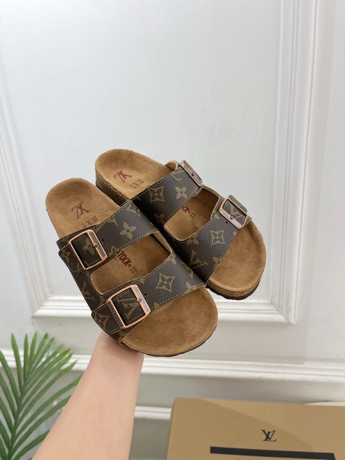 Monogram slide sandals with two silver buckles and tan footbed