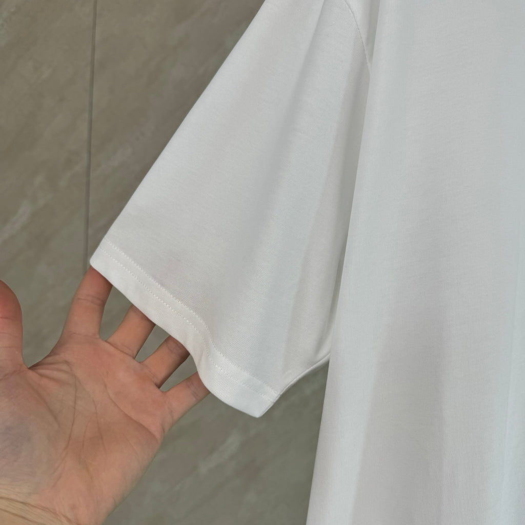 White Dior T-shirt with short sleeve and clean hem finish.
