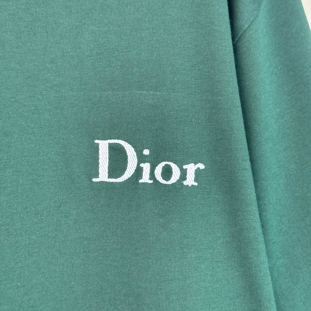 Dior logo on dark green T-shirt fabric