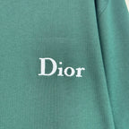 Dior logo on dark green T-shirt fabric