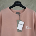 Pink short-sleeve T-shirt with Dior logo and hanging brand tag