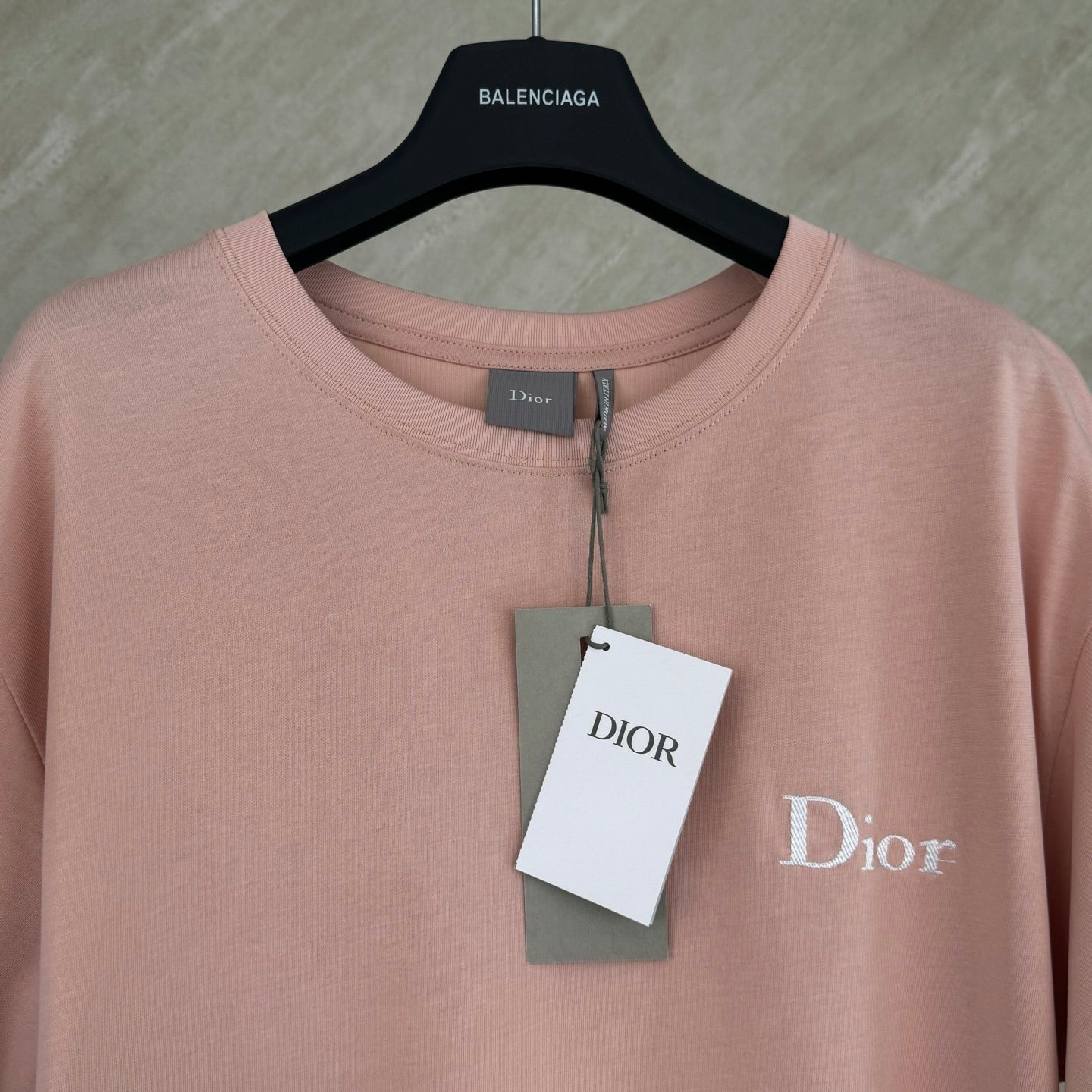 Pink short-sleeve T-shirt with Dior logo and hanging brand tag