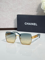Gold-rim square sunglasses with light green gradient lenses, CHANEL branding on case