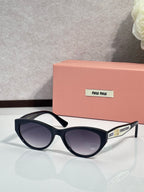 MiuMiu sunglasses with black frames and purple tinted lenses