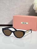 MiuMiu sunglasses with black frames and brown tinted lenses