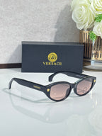 Versace sunglasses with black frame and pink lenses, side logo