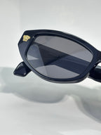 Versace sunglasses side profile with dark blue frame and blue-gray lenses