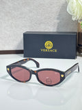 Versace sunglasses with dark tortoiseshell frame and pink tinted lenses