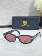 Versace sunglasses with dark tortoiseshell frame and pink tinted lenses