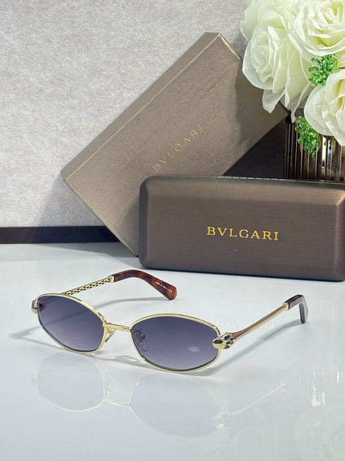 Gold-tone round sunglasses with dark blue lenses and slim metal arms