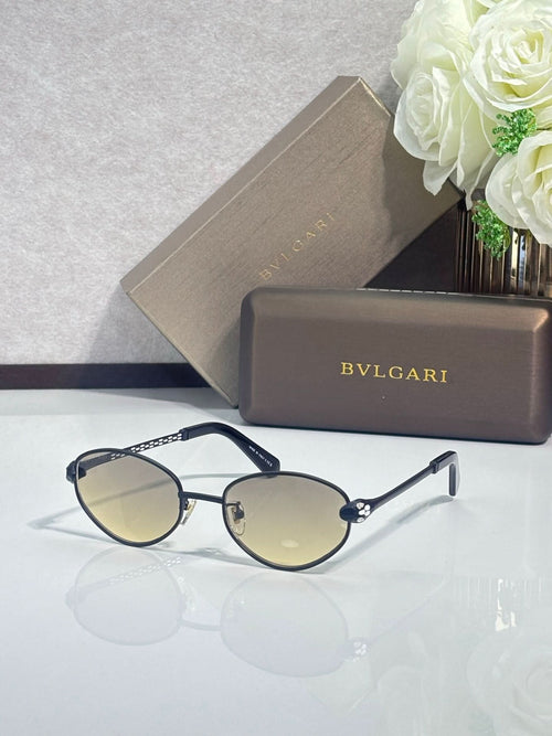 Bvlgari glasses with gold round frames, dark lenses, and dark blue temples