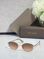Bvlgari glasses with rose-gold round frames, light brown lenses, and pale temples