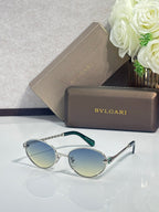 Bvlgari glasses with silver round frames, blue gradient lenses, and green temple tips
