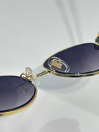 Bvlgari glasses with dark blue gradient lens and gold temple hinge