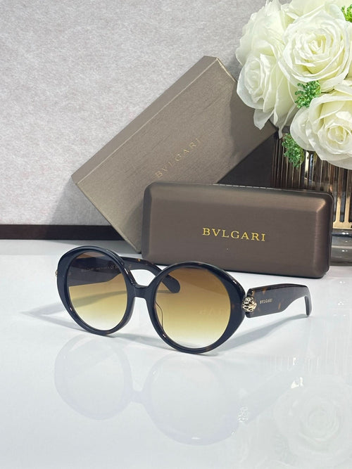 Round sunglasses with dark blue frames and yellow-tinted lenses