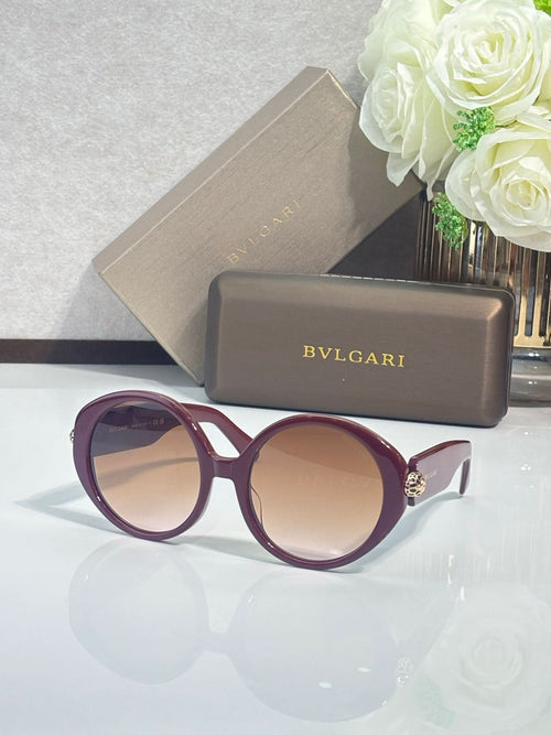 Round sunglasses with deep purple frames and light beige-tinted lenses
