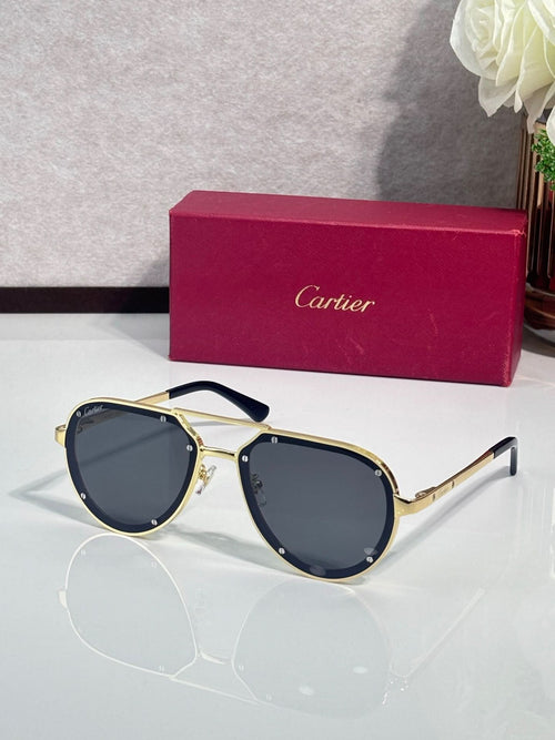 Cartier sunglasses with gold frame and dark blue lenses, cat-eye shape