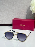 Cartier sunglasses with gold frame and dark blue lenses, angled front