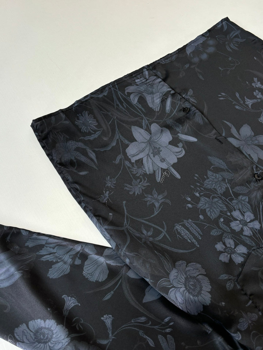 Gucci long-sleeve shirt folded side view, dark navy floral pattern