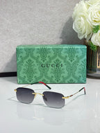 Gucci rectangular sunglasses with gold frame and dark gray lenses