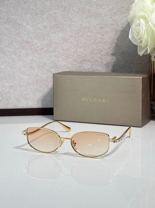 Bvlgari sunglasses with gold frame and light amber lenses