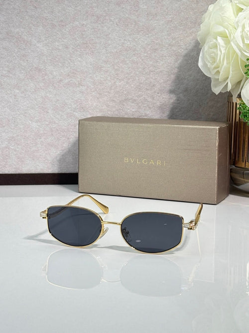 Bvlgari sunglasses with gold frame and dark blue lenses