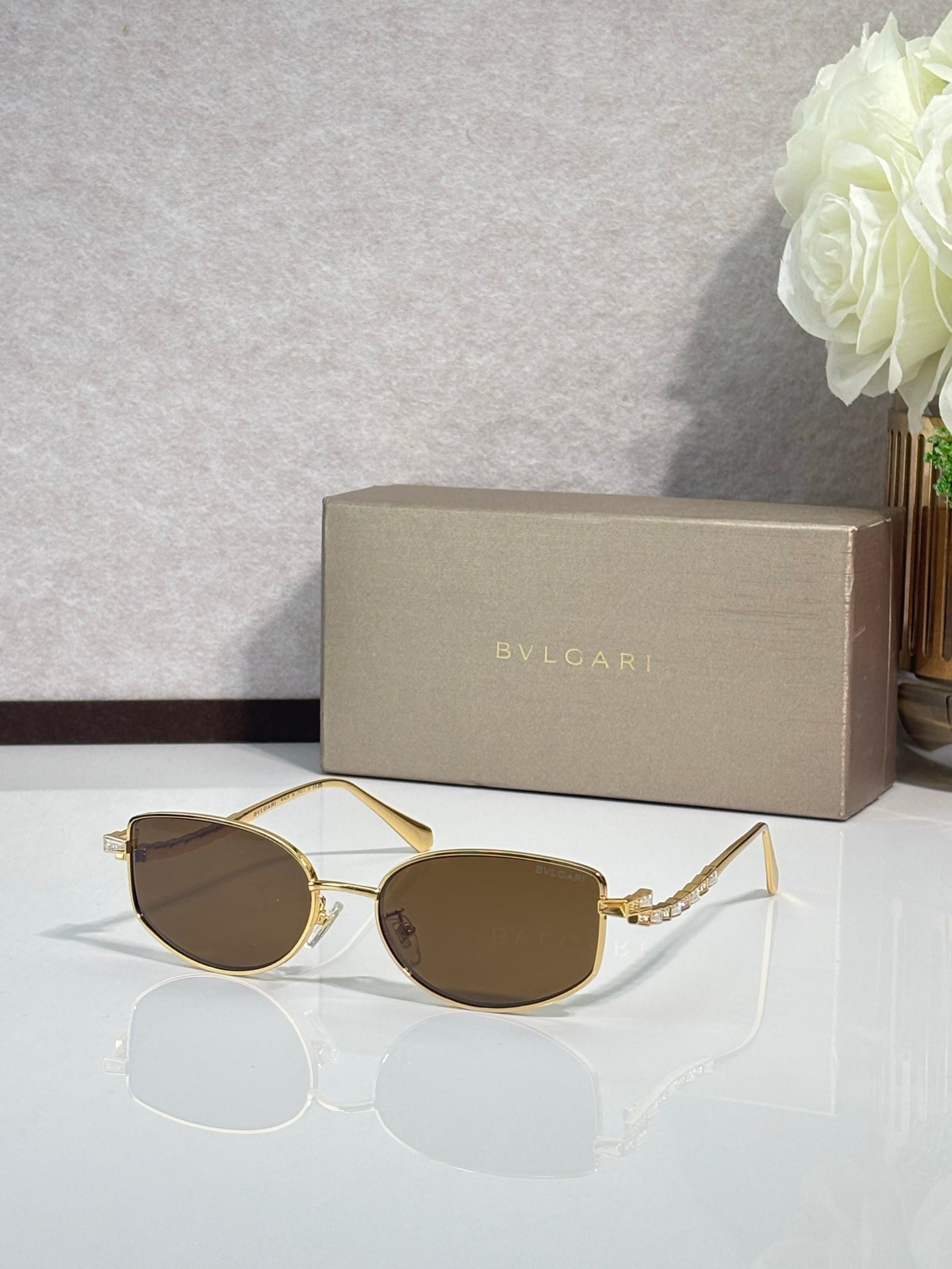 Bvlgari sunglasses with gold frame and dark brown lenses