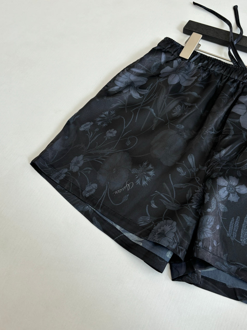 Gucci floral print shorts, dark patterned fabric with drawstring ties