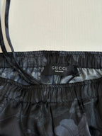 Gucci shorts waistband label, dark floral print, elastic drawstring