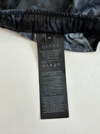 Gucci size tag on dark shorts, size 46 with care instructions