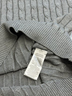Light gray cable-knit polo collar with inside neck tag label