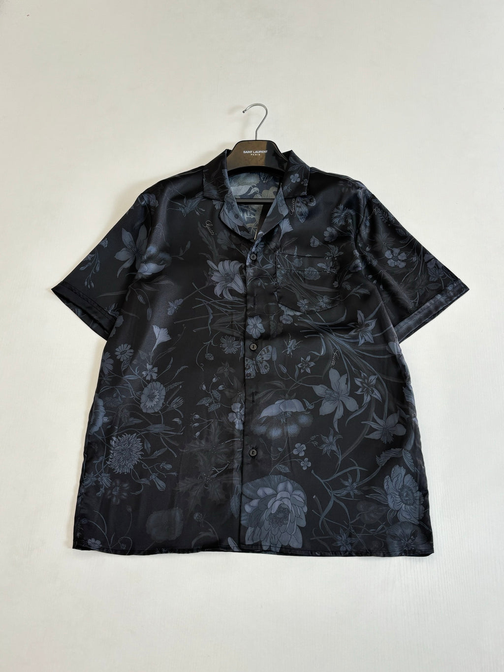 Gucci short-sleeve button-up shirt with collar, dark fabric and blue floral print