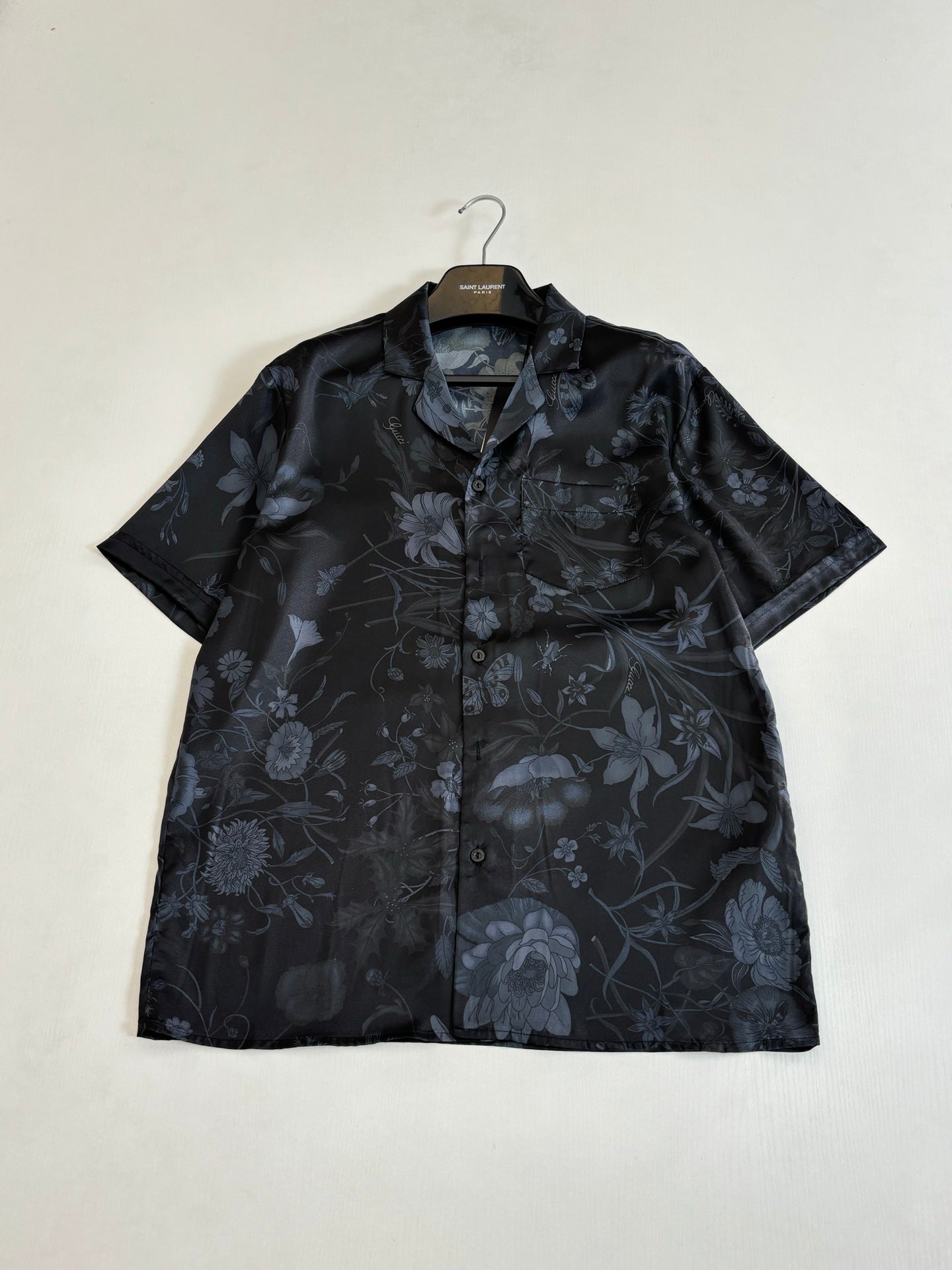 Gucci short-sleeve button-up shirt with collar, dark fabric and blue floral print