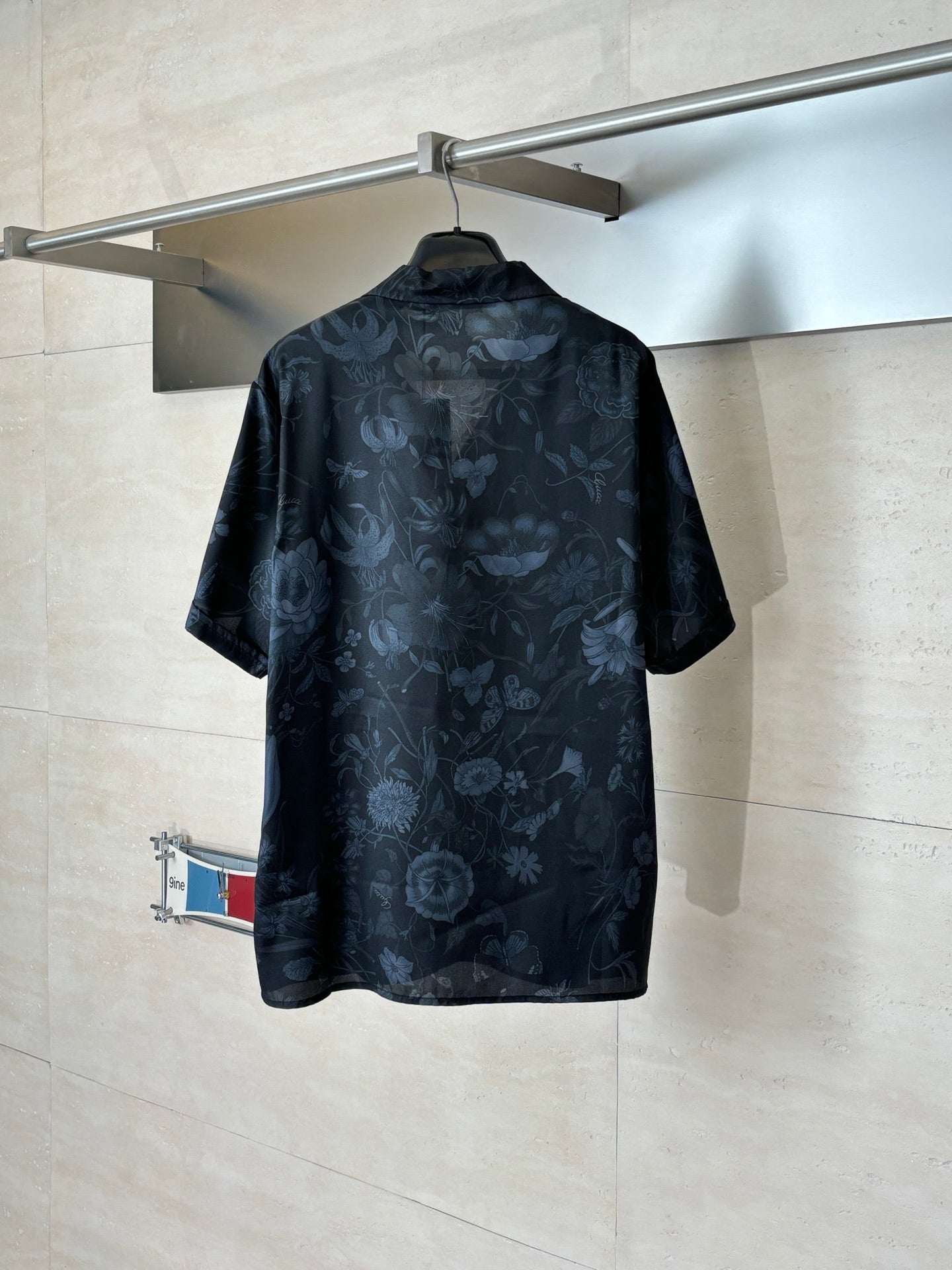 Gucci short-sleeve button-up shirt, back view with blue floral print