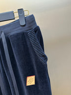 Louis Vuitton pants close-up, dark navy ribbed waistband and textured side seam