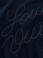 Navy jacket with subtle embossed script logo on back panel