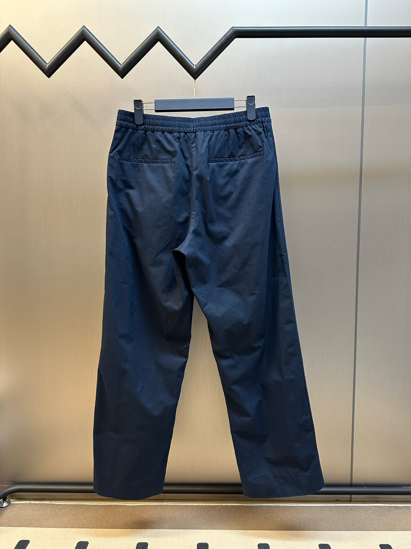 Gucci navy pants with elastic waistband and side red stripe, full view