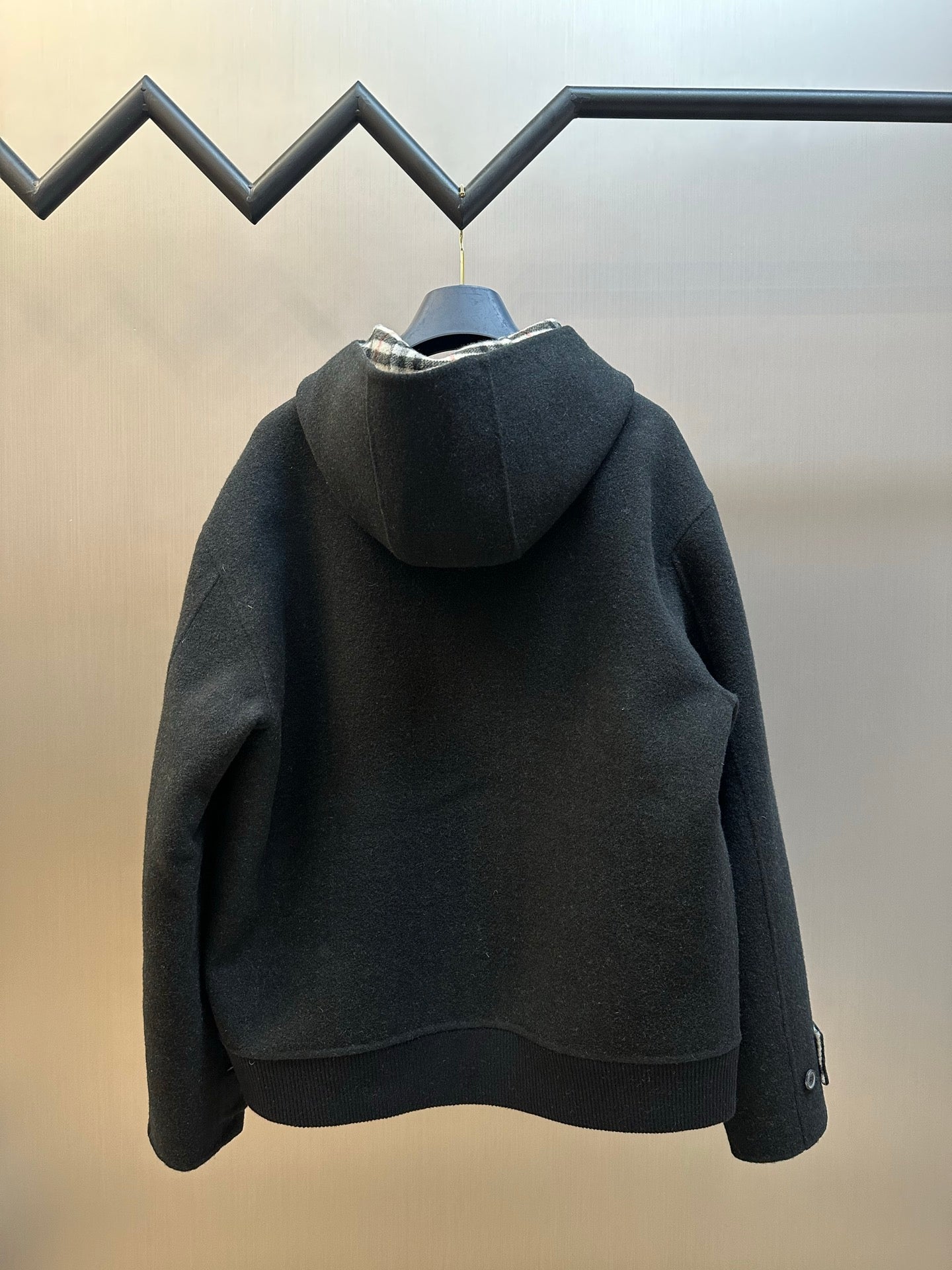 Burberry hooded zip jacket rear view, dark charcoal, no-pattern solid with ribbed hem